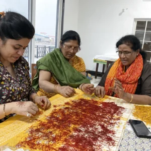 Hand-separating saffron stigmas from crocus flowers