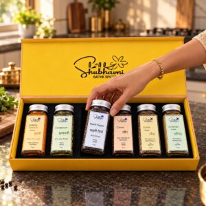 Taking a jar of kali mirch from the Shubhavni Satvik Spices box in a home kitchen