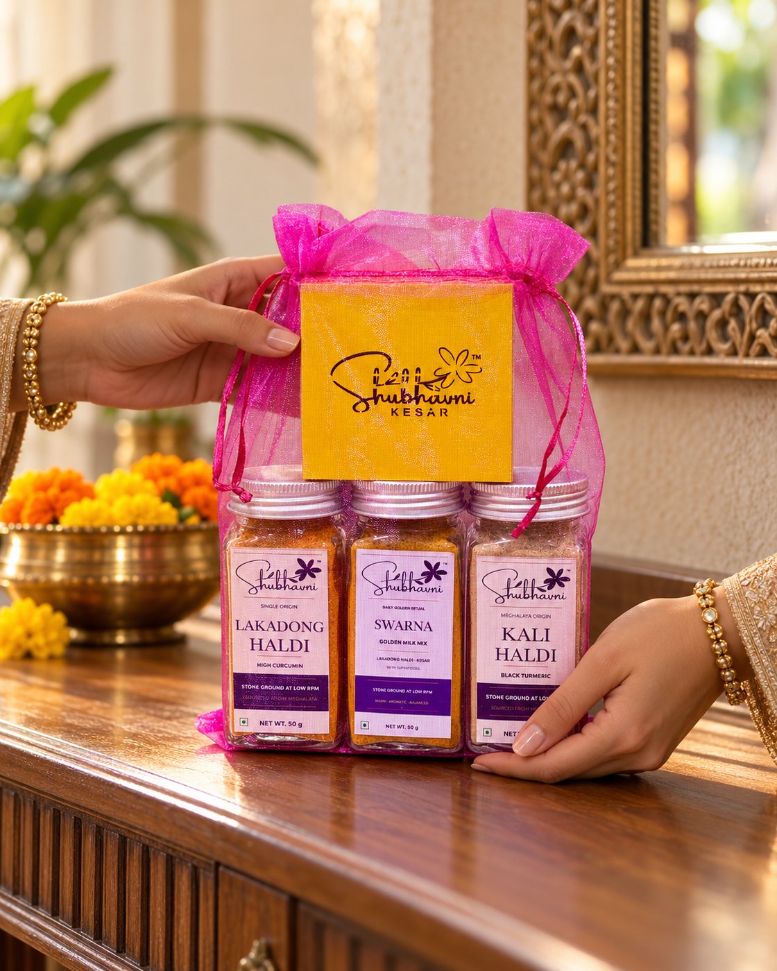 Shubhavni Celebration Trio potli being placed on a festive table